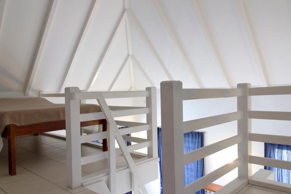 Postel nebo postele na pokoji v ubytování Orange Rembrandt Studio Apartments