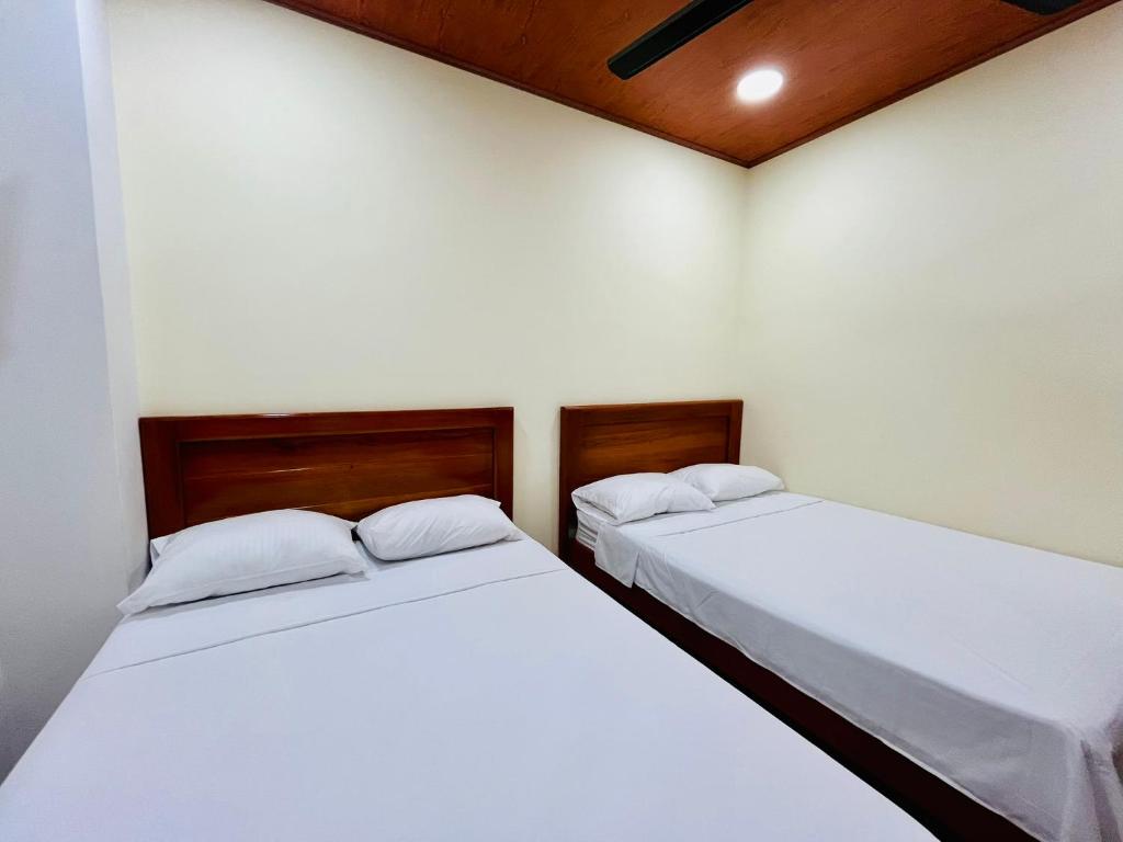 Postel nebo postele na pokoji v ubytování Aparta Hotel Horinthia
