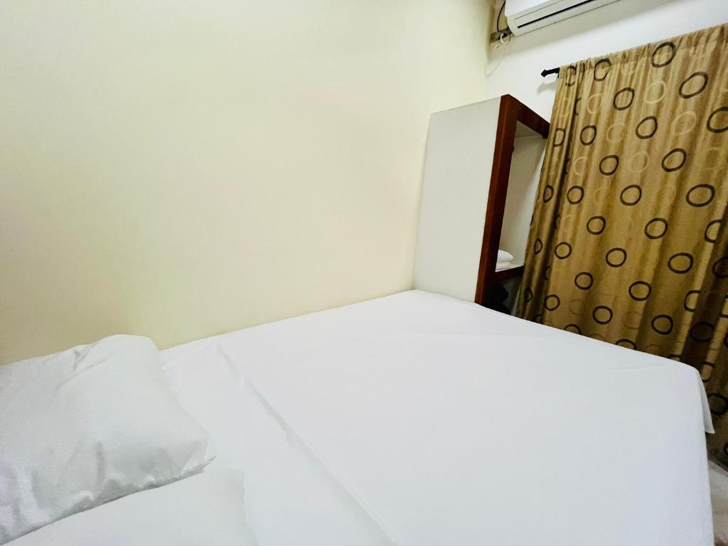 Postel nebo postele na pokoji v ubytování Aparta Hotel Horinthia