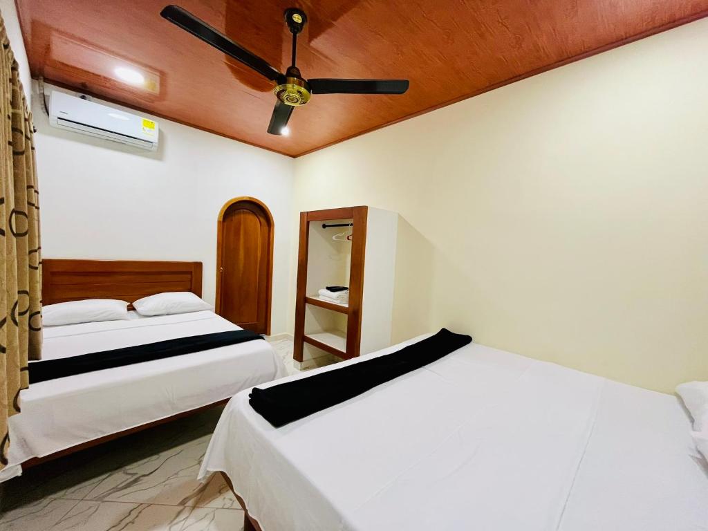 Postel nebo postele na pokoji v ubytování Aparta Hotel Horinthia