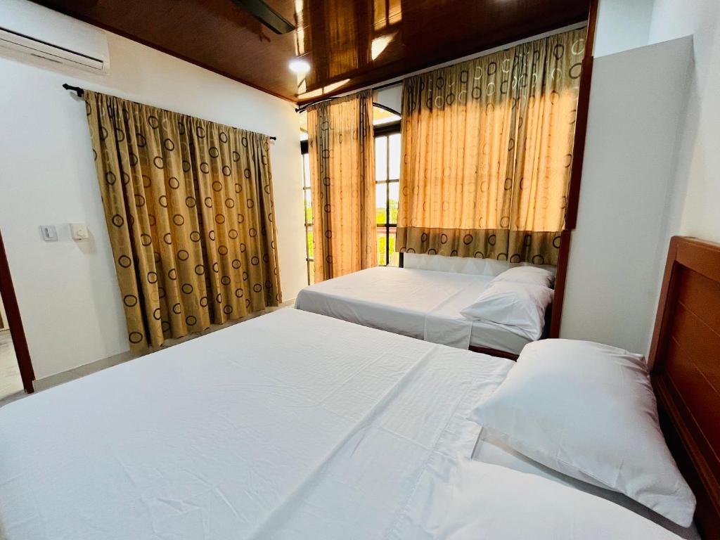 Postel nebo postele na pokoji v ubytování Aparta Hotel Horinthia