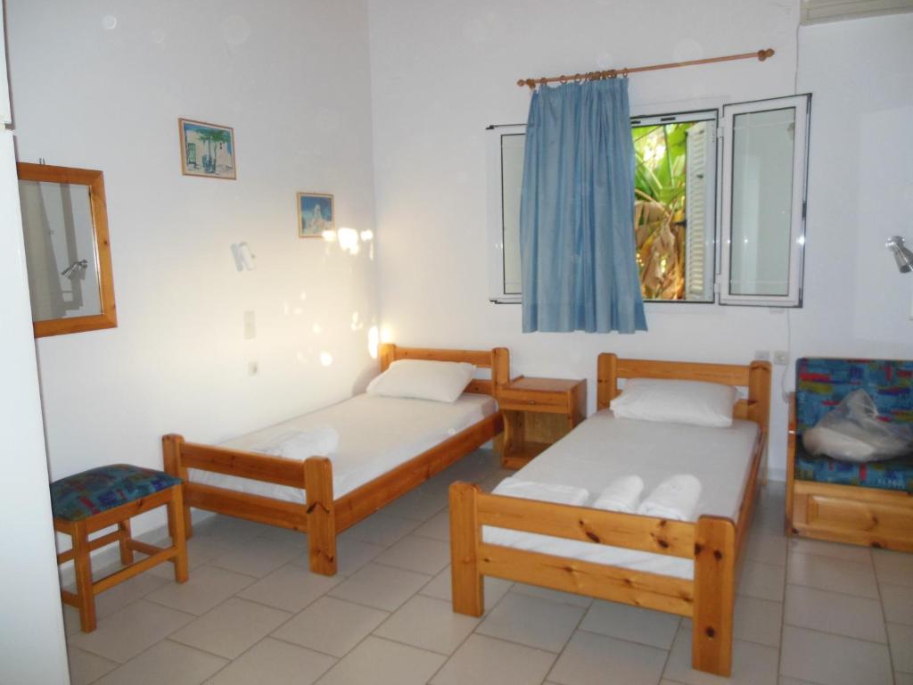 Postel nebo postele na pokoji v ubytování Helonata Apartments