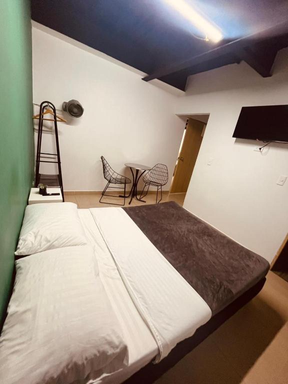Postel nebo postele na pokoji v ubytování Apartahotel Tonchala