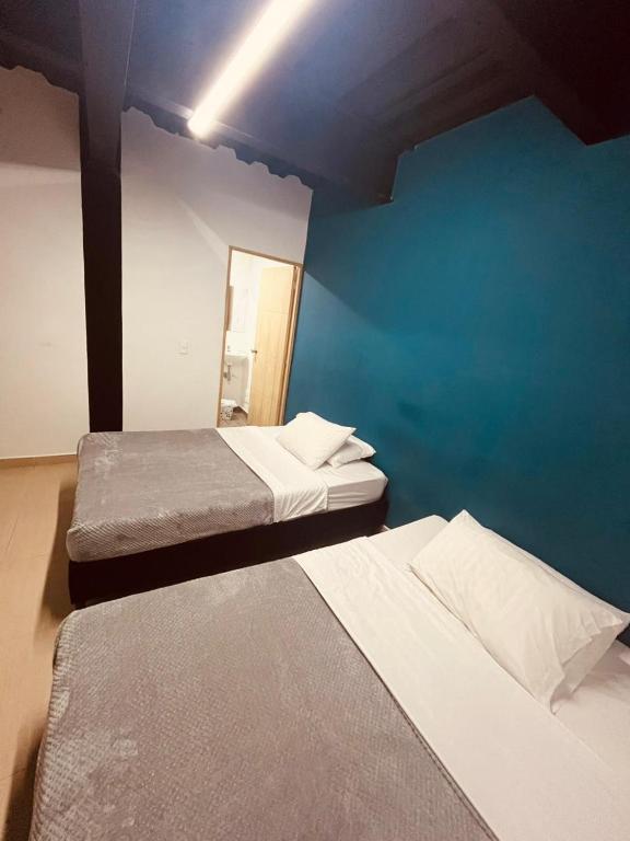 Postel nebo postele na pokoji v ubytování Apartahotel Tonchala