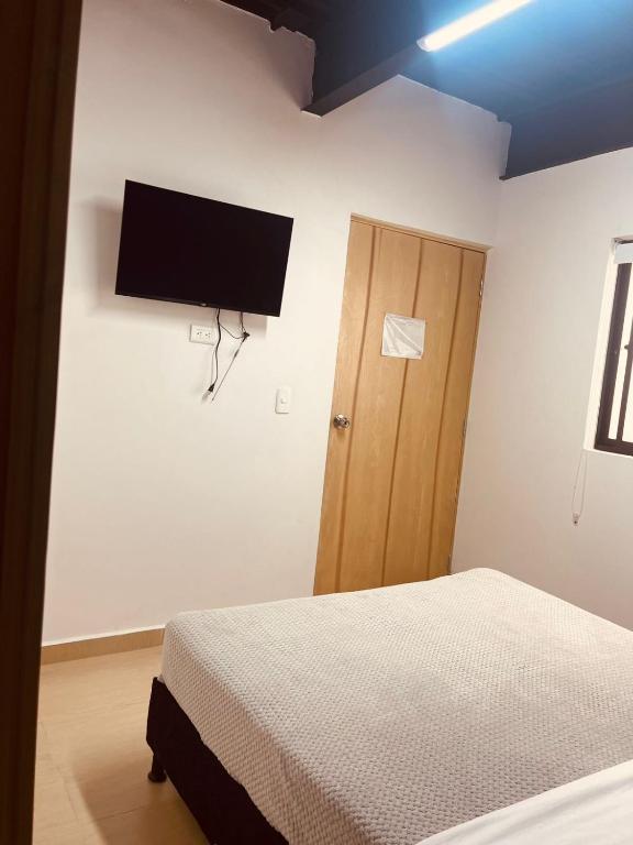 Postel nebo postele na pokoji v ubytování Apartahotel Tonchala