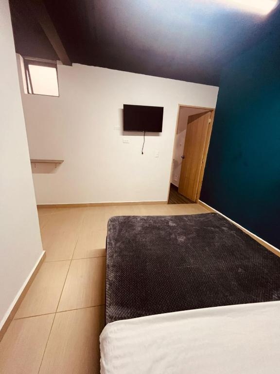 Postel nebo postele na pokoji v ubytování Apartahotel Tonchala