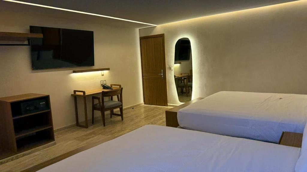 Postel nebo postele na pokoji v ubytování Hotel Makkan Boca