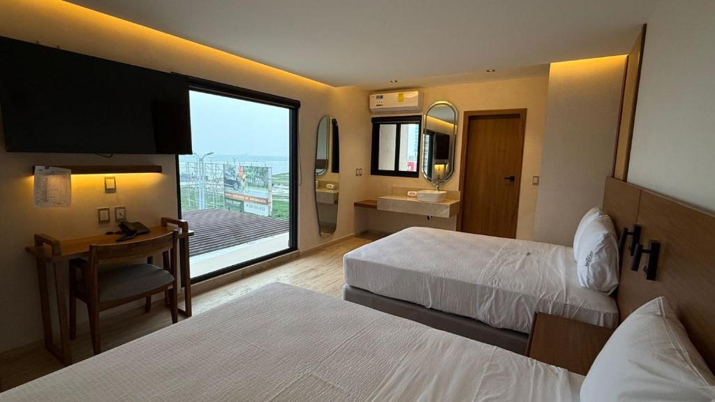 Postel nebo postele na pokoji v ubytování Hotel Makkan Boca