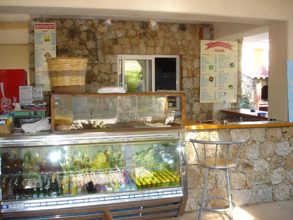 a kitchen filled with lots of fruits and vegetables at Camping la Clé des Champs in Calvi