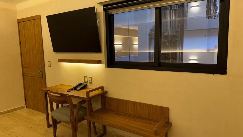 TV a/nebo společenská místnost v ubytování Hotel Makkan Boca