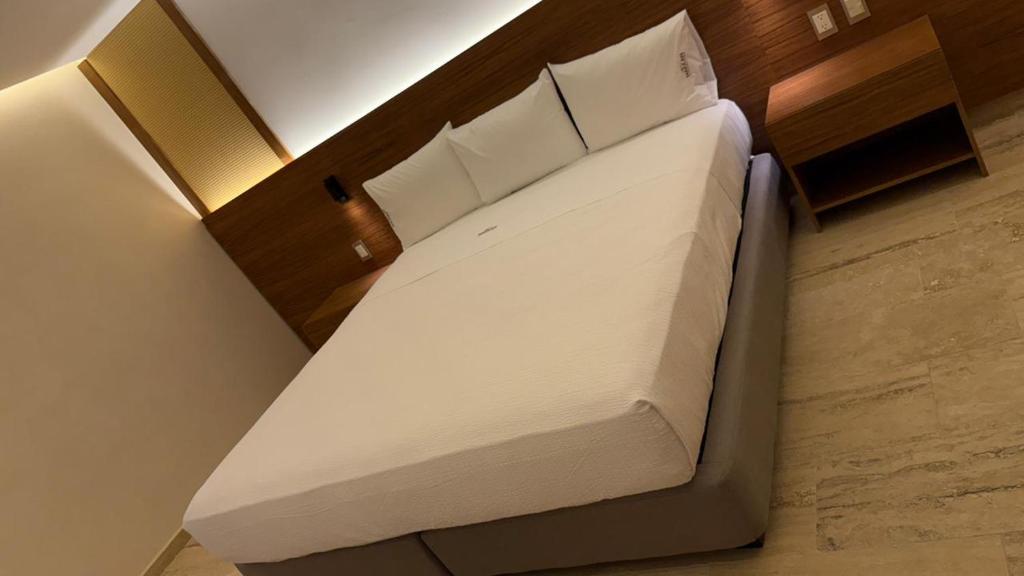 Postel nebo postele na pokoji v ubytování Hotel Makkan Boca