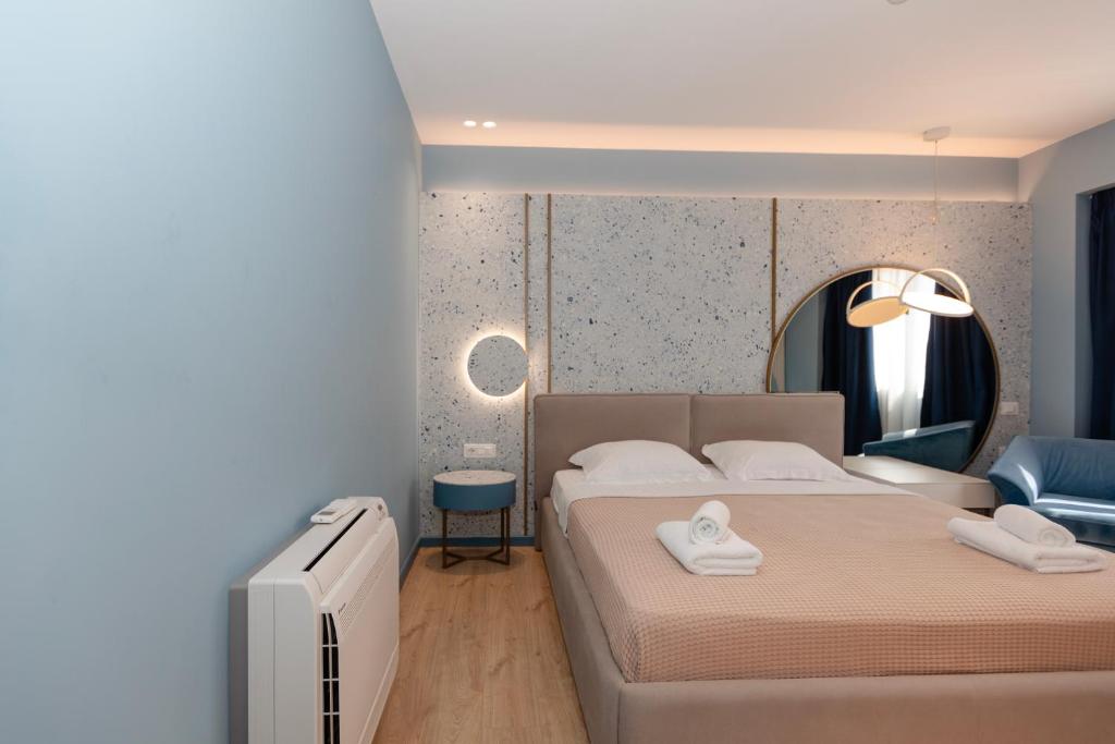 Postel nebo postele na pokoji v ubytování Imperial Visar Rooms