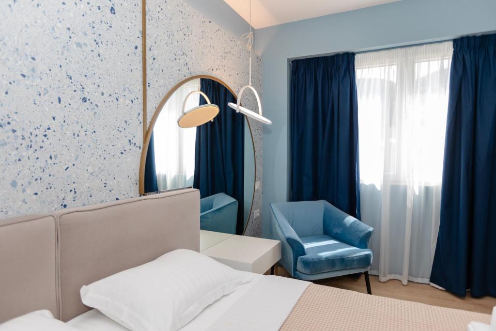 Postel nebo postele na pokoji v ubytování Imperial Visar Rooms