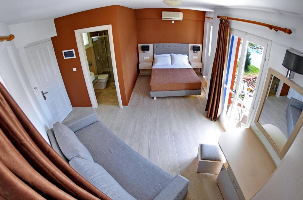 Postel nebo postele na pokoji v ubytování Vliho Bay Boutique Hotel