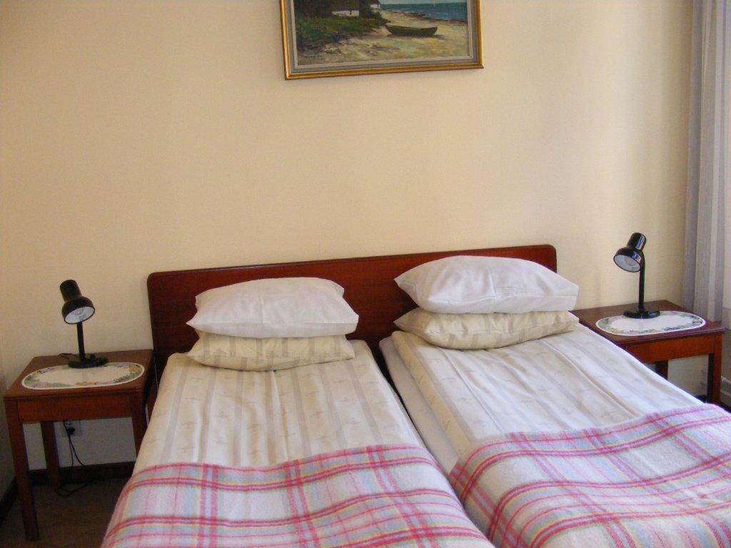 Postel nebo postele na pokoji v ubytování Hotel Continental Malmö
