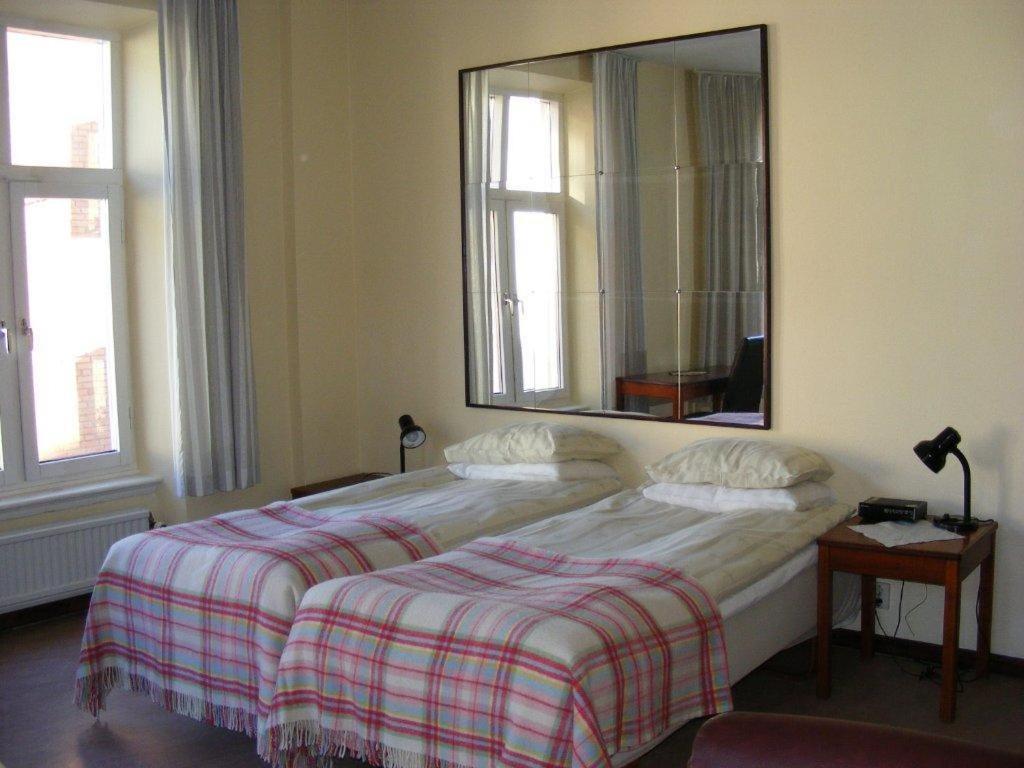 Postel nebo postele na pokoji v ubytování Hotel Continental Malmö