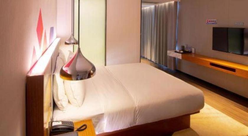 Cama o camas de una habitación en Borrman Hotel Zhanjiang Xuwen Port Terminal