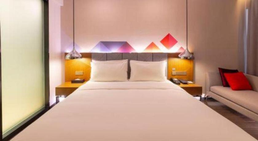 Cama o camas de una habitación en Borrman Hotel Zhanjiang Xuwen Port Terminal