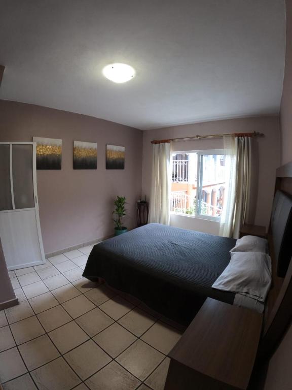 Postel nebo postele na pokoji v ubytování Casa León