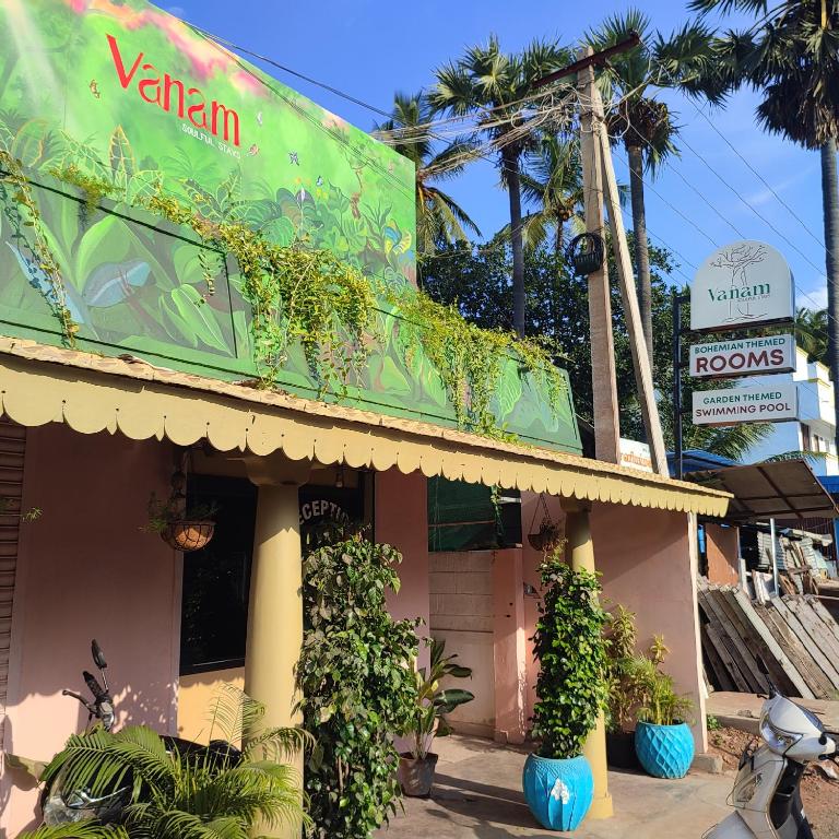 a building with plants on the side of it at Vanam Soulful Stays in Pondicherry