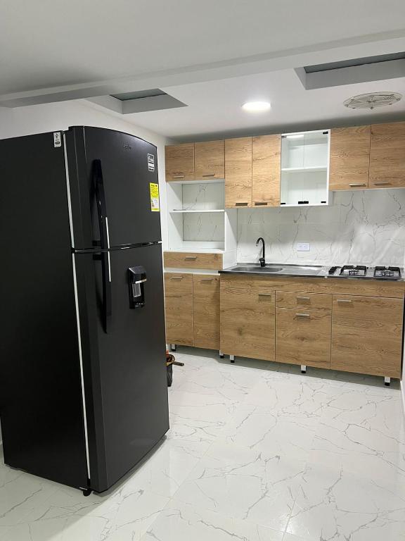 Kuchyň nebo kuchyňský kout v ubytování Alojamiento Privado en Avenida Principal