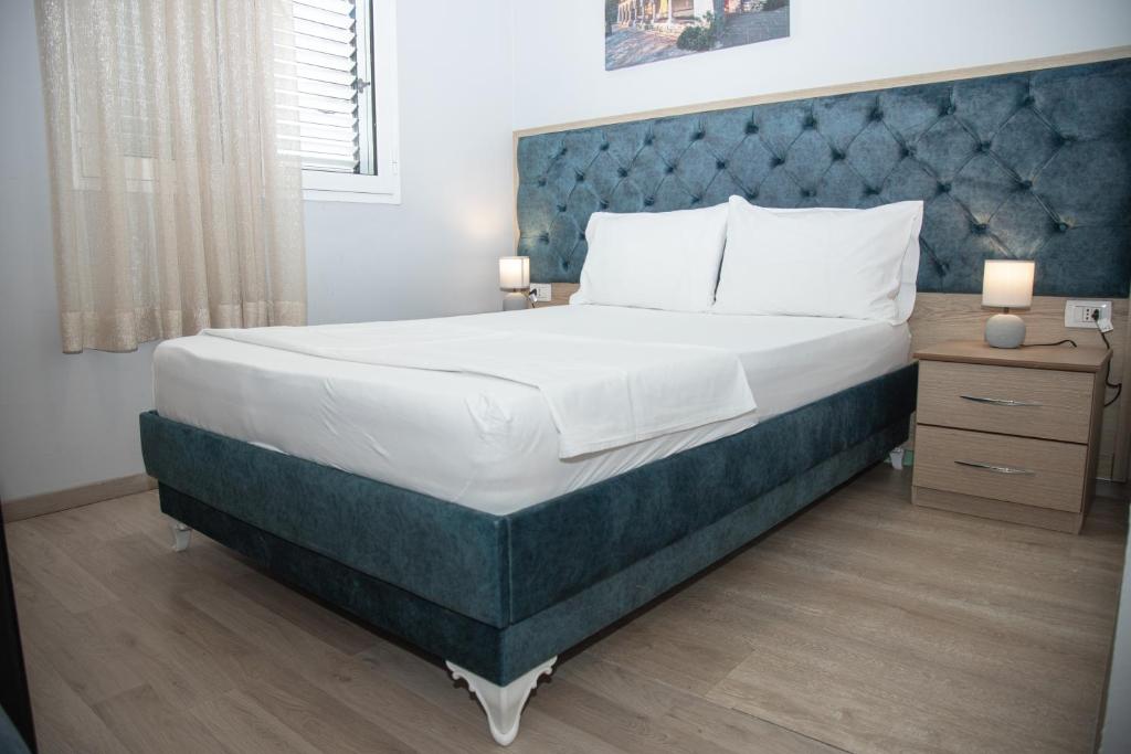 Postel nebo postele na pokoji v ubytování Hotel Number One