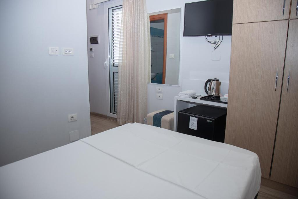 Postel nebo postele na pokoji v ubytování Hotel Number One