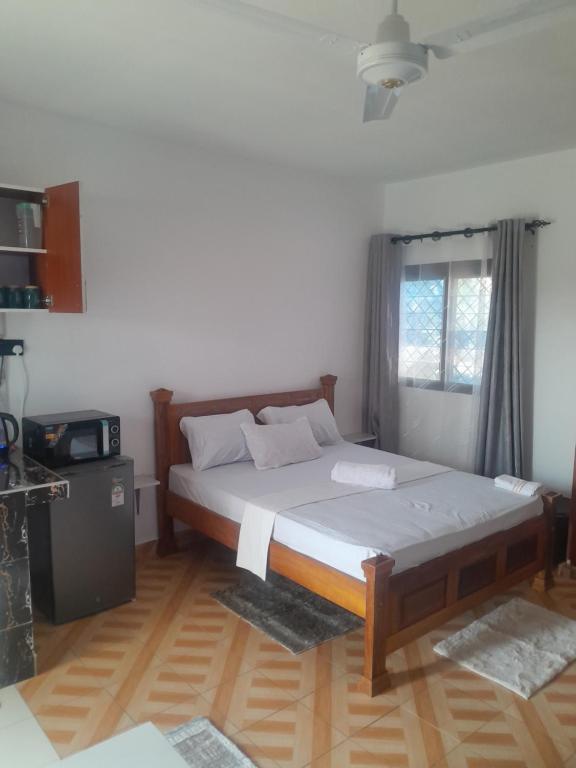 Postel nebo postele na pokoji v ubytování Kelly Homes