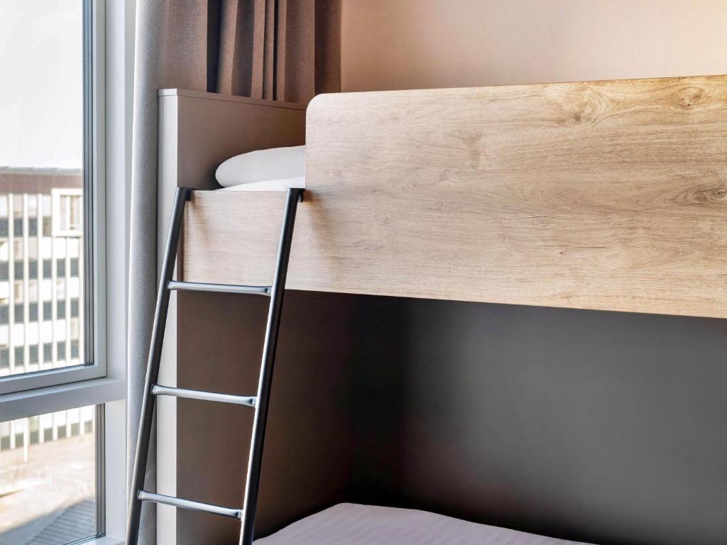 Postel nebo postele na pokoji v ubytování B&B HOTEL Wien-Heiligenstadt