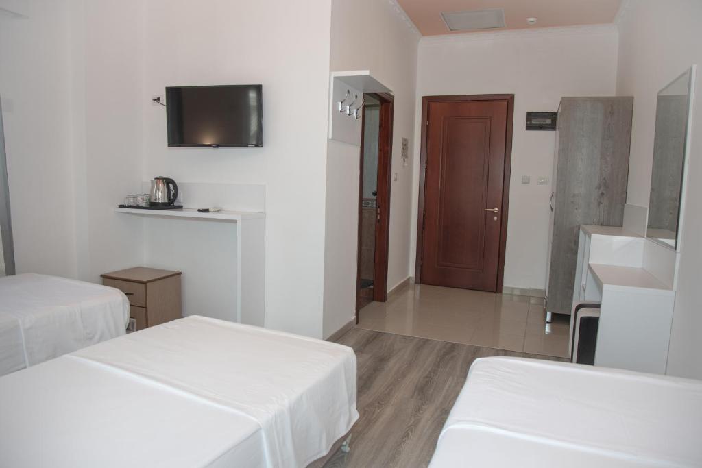 Postel nebo postele na pokoji v ubytování Hotel Number One