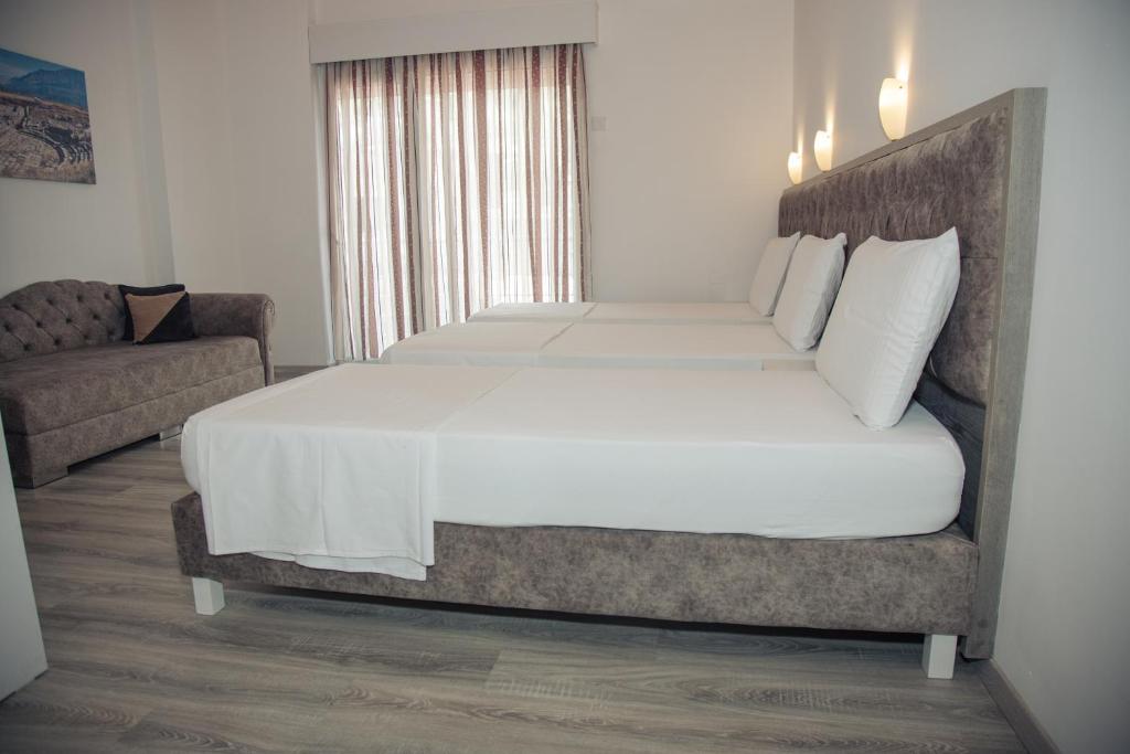 Postel nebo postele na pokoji v ubytování Hotel Number One