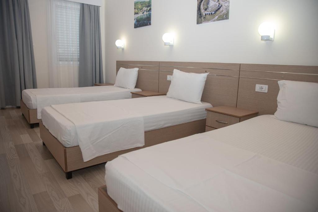 Postel nebo postele na pokoji v ubytování Hotel Number One