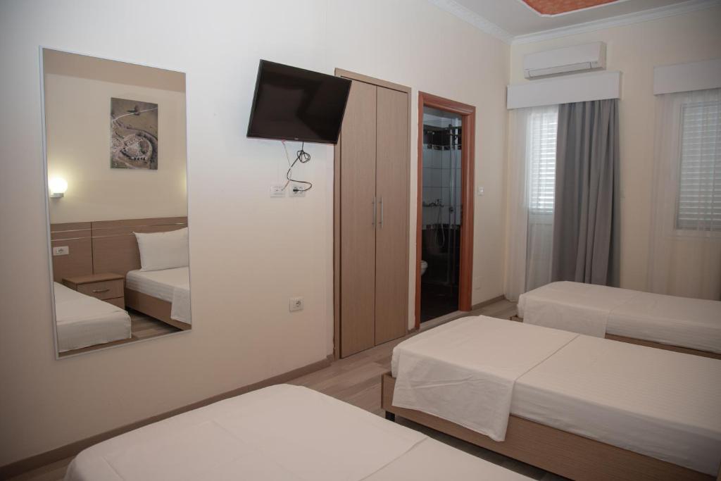 Postel nebo postele na pokoji v ubytování Hotel Number One