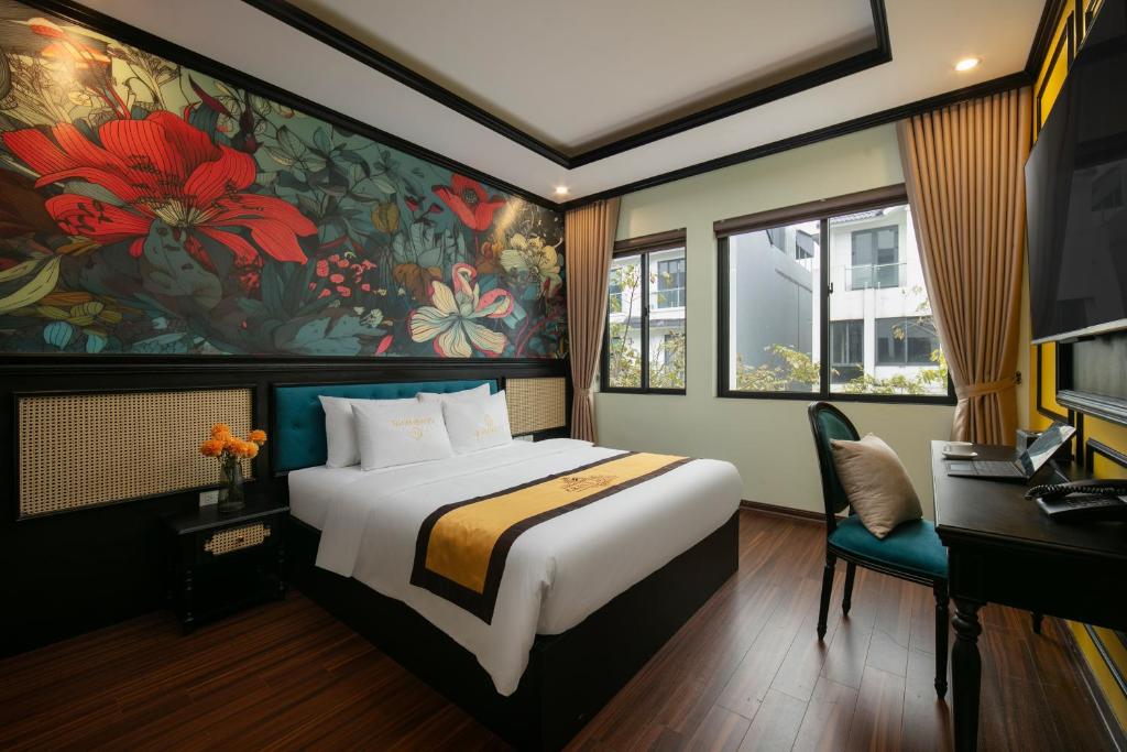 Postel nebo postele na pokoji v ubytování Grand Hanoi Hotel