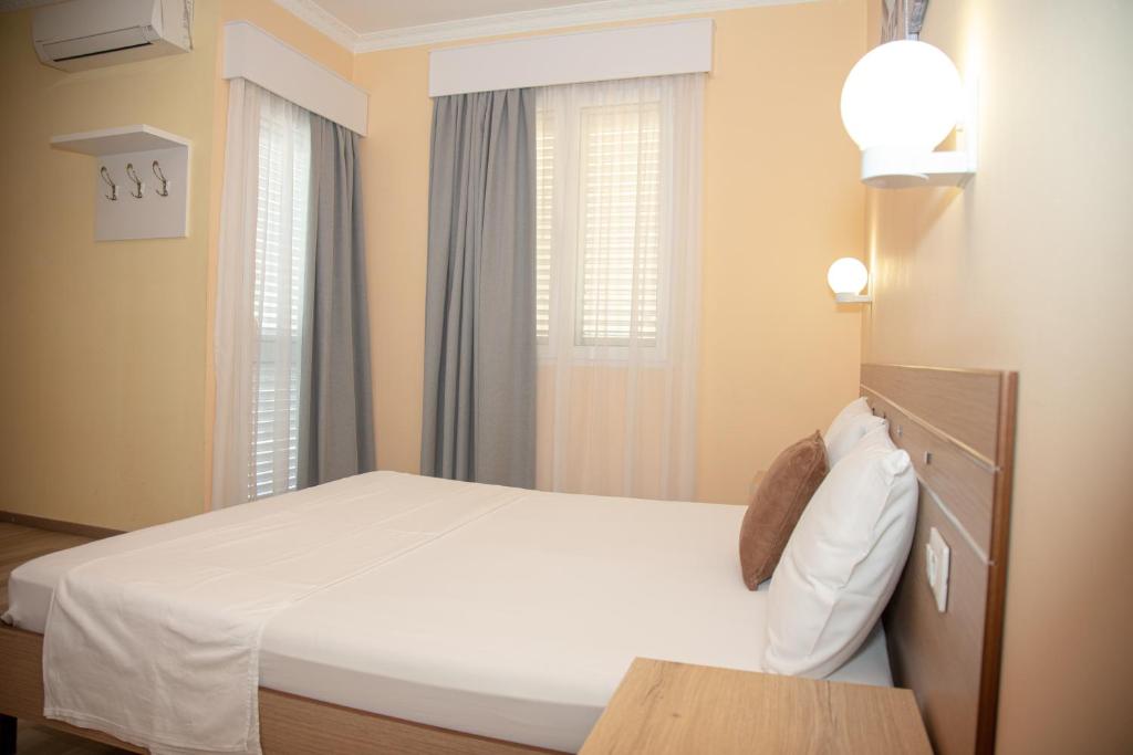 Postel nebo postele na pokoji v ubytování Hotel Number One