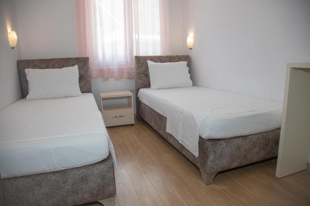 Postel nebo postele na pokoji v ubytování Hotel Number One