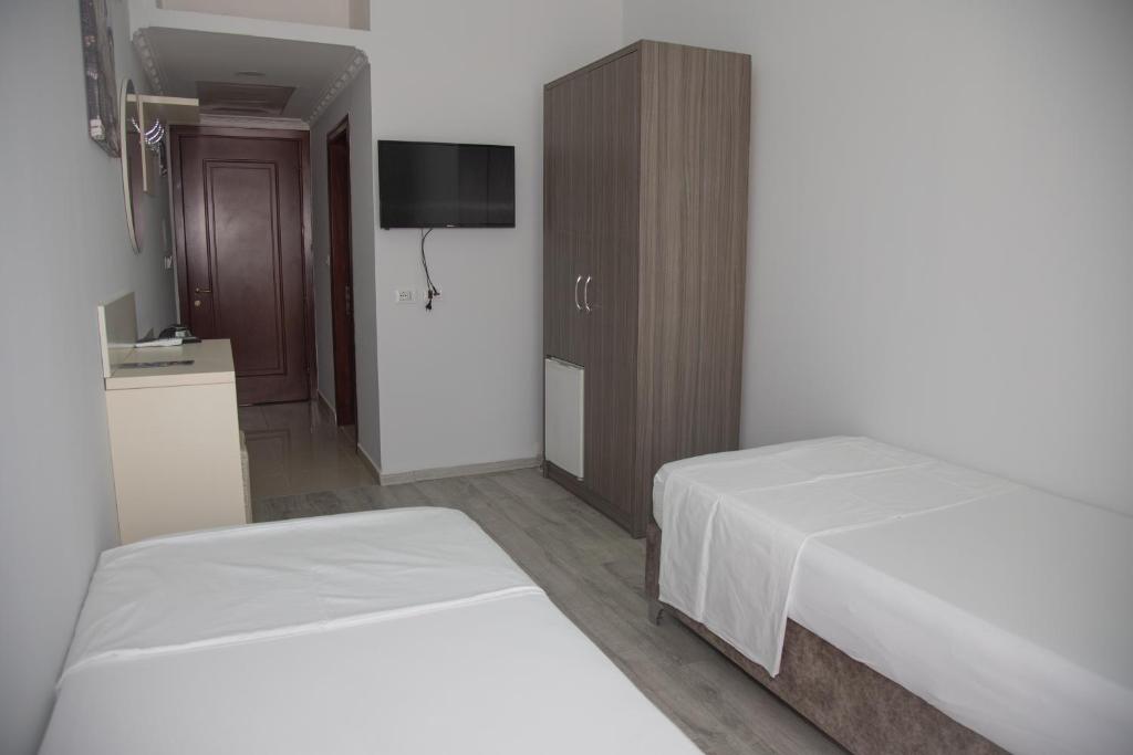 Postel nebo postele na pokoji v ubytování Hotel Number One