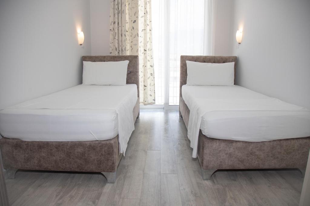 Postel nebo postele na pokoji v ubytování Hotel Number One