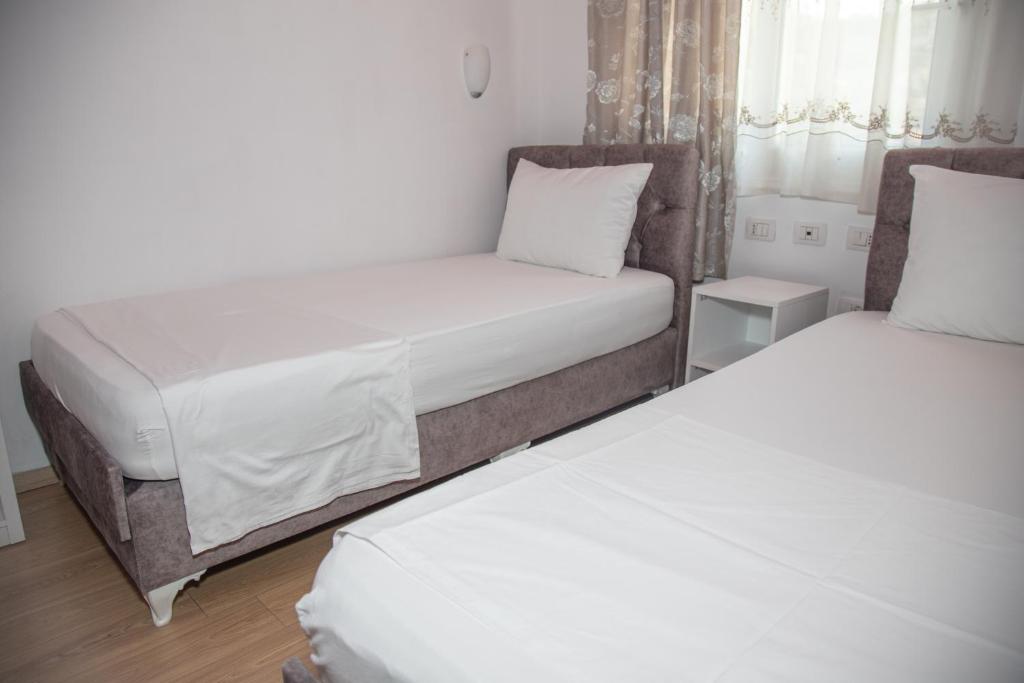 Postel nebo postele na pokoji v ubytování Hotel Number One