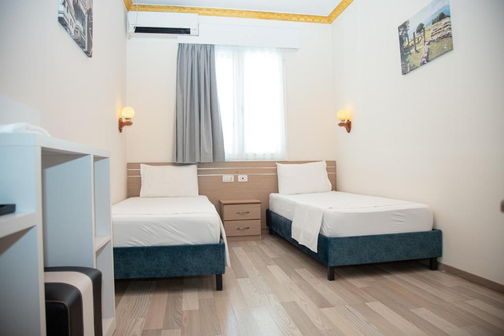 Postel nebo postele na pokoji v ubytování Hotel Number One