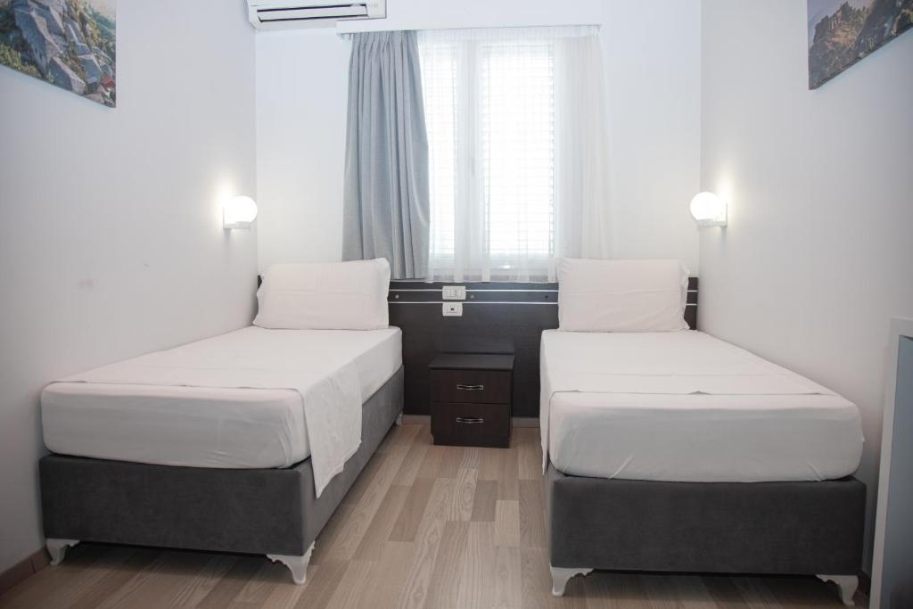 Postel nebo postele na pokoji v ubytování Hotel Number One
