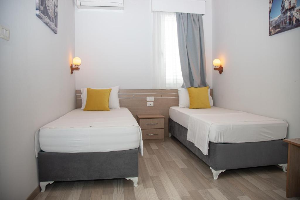 Postel nebo postele na pokoji v ubytování Hotel Number One