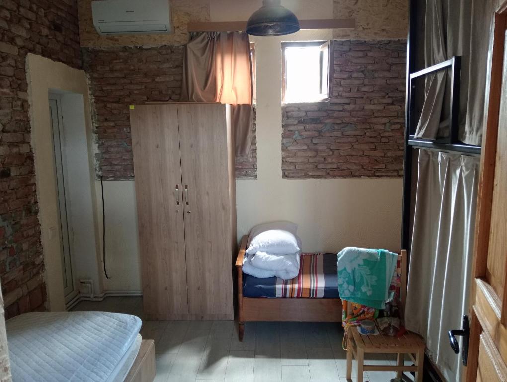Postel nebo postele na pokoji v ubytování Tbilisi Royal View