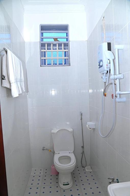 Koupelna v ubytování Tian Hotel