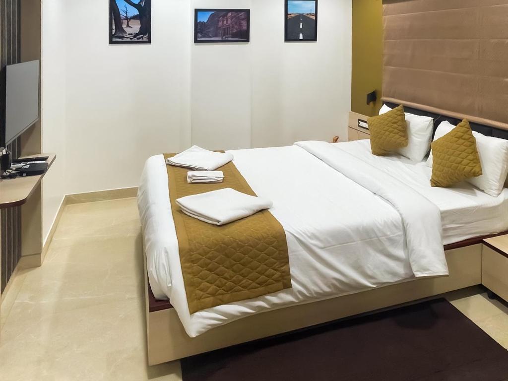 Postel nebo postele na pokoji v ubytování The Executive Inn