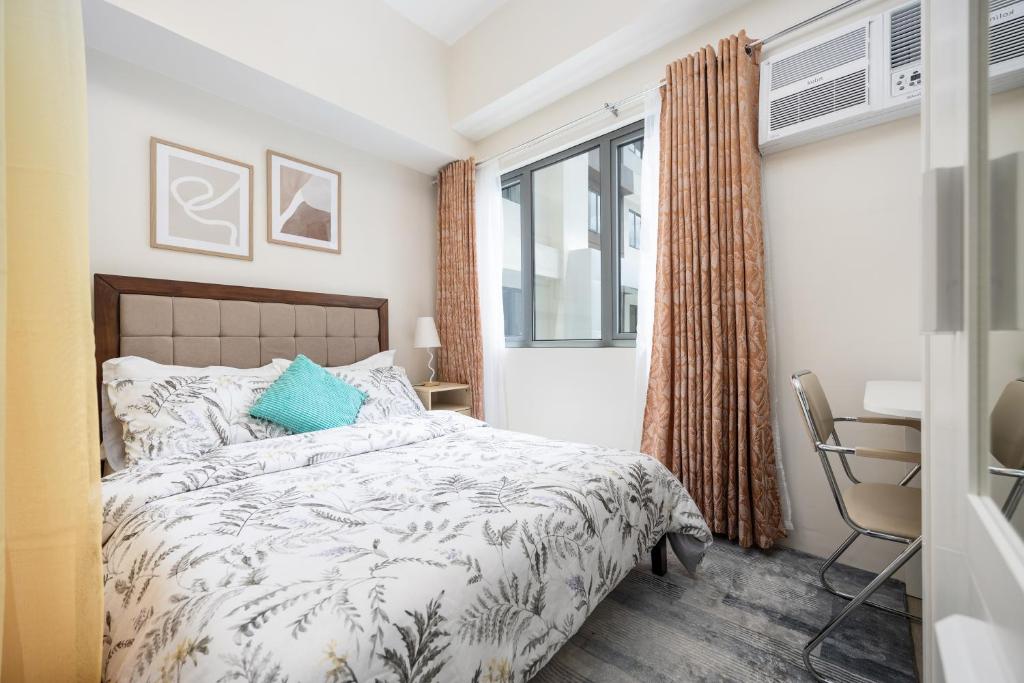 Postel nebo postele na pokoji v ubytování LD Cozy Condo Unit - BE Residences near Cebu IT Park