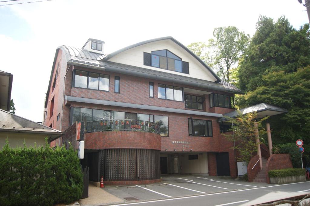 a large red brick building with a round roof at Wakamizusou in Fujikawaguchiko