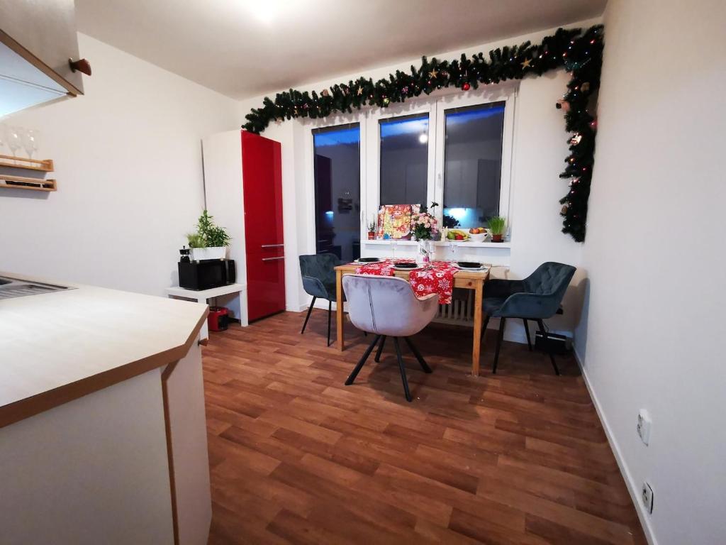 a kitchen and dining room with a table and chairs at Star Apartments Brno #3B315 by Starbnb EU in Brno