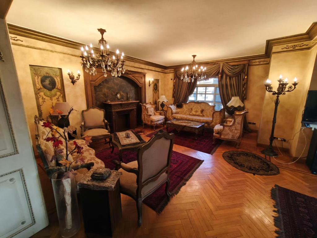 an overhead view of a living room with a couch at Legacy Lodge Heliopolis in Cairo