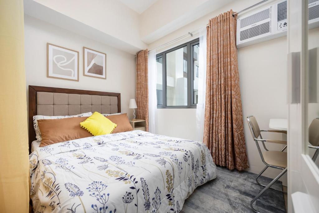Postel nebo postele na pokoji v ubytování LD Cozy Condo Unit - BE Residences near Cebu IT Park